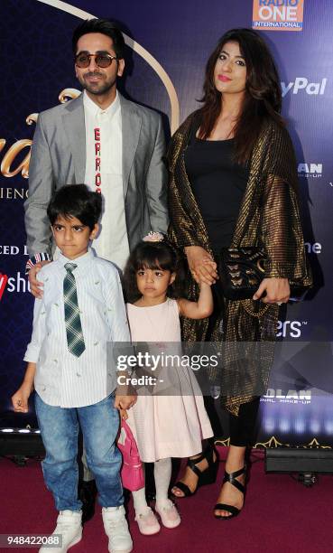 Indian Bollywood actor and singer Ayushmann Khurrana and family attends the Disneys Aladdin Broadway-style musical show in Mumbai on April 18, 2018....