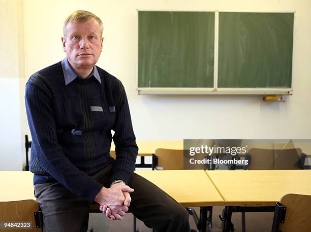 Wolfgang Renner, a math and physics teacher at the Clara Zetkin Middle School, poses in a classroom at the school in Freiberg, Germany, on Thursday,...