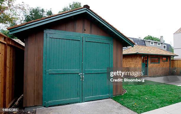 The 'HP Garage,' left, stands in the backyard of the former home of Bill Hewlett and Dave Packard in Palo Alto, California, Monday, November 28,...