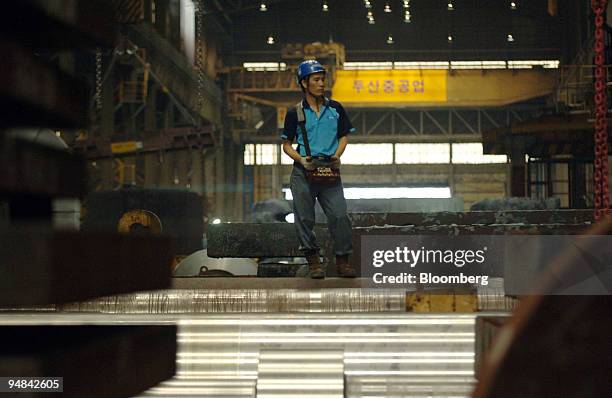 An employee works at Doosan Heavy Industries & Construction Co.'s Changwon plant in Changwon, South Korea, on Thursday, Sept. 25, 2008. Doosan Heavy...