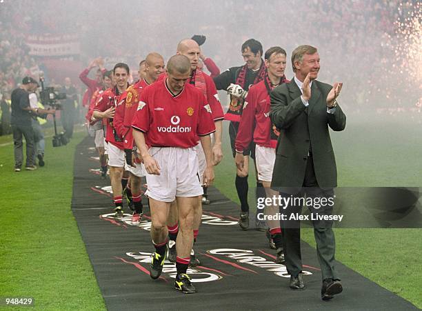 Alex Ferguson and Roy Keane lead out the Manchester United team to celebrate being crowned FA Carling Premier League Champions after the match...