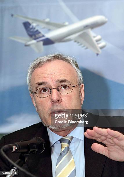 Airbus SAS Chairman and chief executive Gustav Humbert speaks in front of an image of a new A380 super jumbo passenger plane at a press conference...