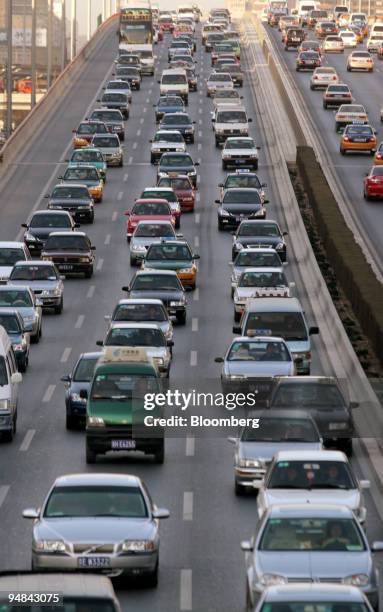 Heavy traffic inches down a major road in eastern Beijing's business district November 28, 2005. Robin Howlett says Beijing was a city of blue skies...