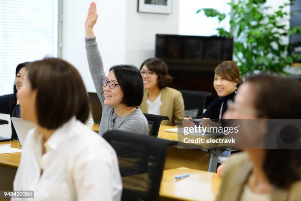 professional women at seminar - japan training session stock pictures, royalty-free photos & images