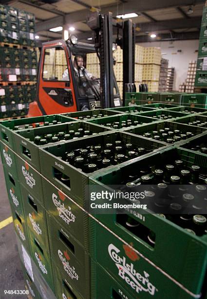 Worker uses a forklift to move cases of beer at the Holsten Brewery in Hamburg, Germany, Monday, November 28, 2005. Holsten Brauerei AG was bought...