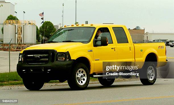 New 2005 Ford F-350 truck is test driven on the road outside the Kentucky Ford Truck plant in Louisville, Kentucky, April 19, 2004. The front grill...