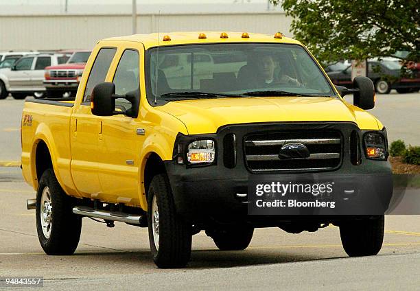 New 2005 Ford F-350 truck is test driven on the road outside the Kentucky Ford Truck plant in Louisville, Kentucky, April 19, 2004. The front grill...
