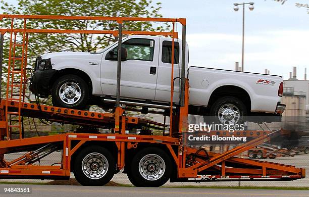 New 2005 Ford "Super Truck" is seen on a car carrier outside the Kentucky Ford Truck plant in Louisville, Kentucky, April 19, 2004. The front grill...