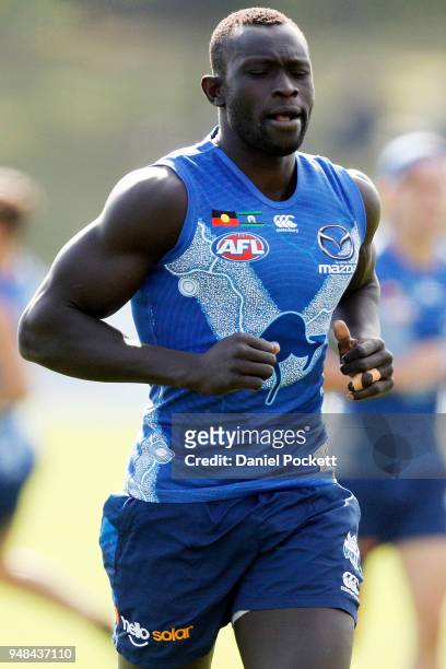 Majak Daw of the Kangaroos in action at Arden Street Ground on April 19, 2018 in Melbourne, Australia.