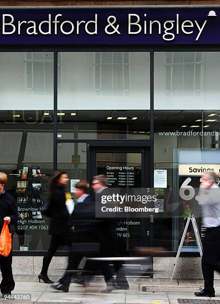 People walk by a Bradford & Bingley bank branch in London, U.K., on Tuesday, Sept. 23, 2008. Bradford & Bingley Plc, the U.K.'s biggest lender to...