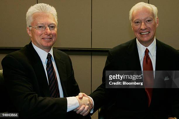 Procter & Gamble Chairman and CEO A.G. Lafley, left, and Gillette Chairman and CEO James Kilts shake hands at the end of a news conference Friday,...