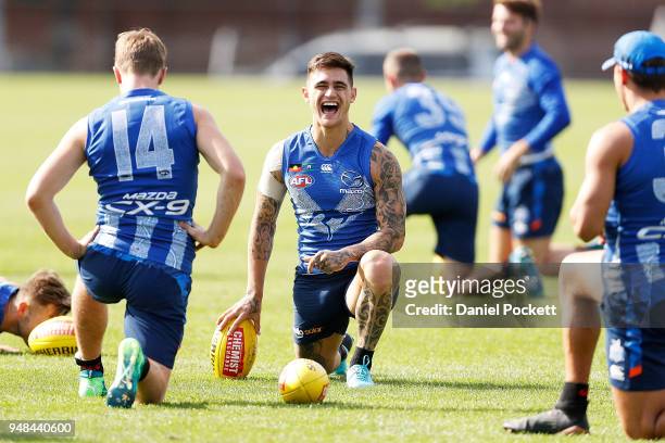 Marley Williams of the Kangaroos shares a laugh at Arden Street Ground on April 19, 2018 in Melbourne, Australia.
