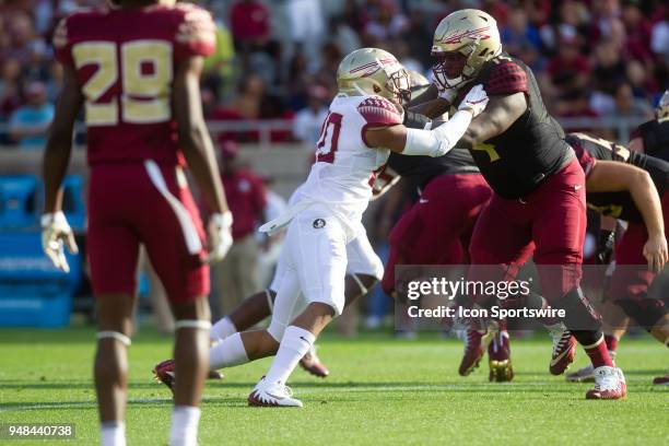 Defensive tackle Derrick Kelly II blocks Jaiden Woodbey during the Florida State spring football game on April 2018 at Bobby Bowden Field at Doak...