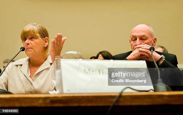 Leroy Hubley, whose wife and son died from an allergic reaction to the blood thinner heparin, right, listens to his daughter-in-law Colleen Hubley...