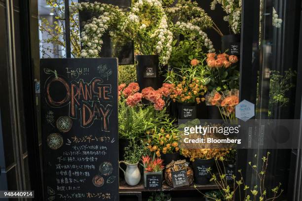 Flowers are displayed for a sale at a store in the Koenji neighborhood in the Tokyo, Japan, on Saturday, April 14, 2018. Japan's headline inflation...