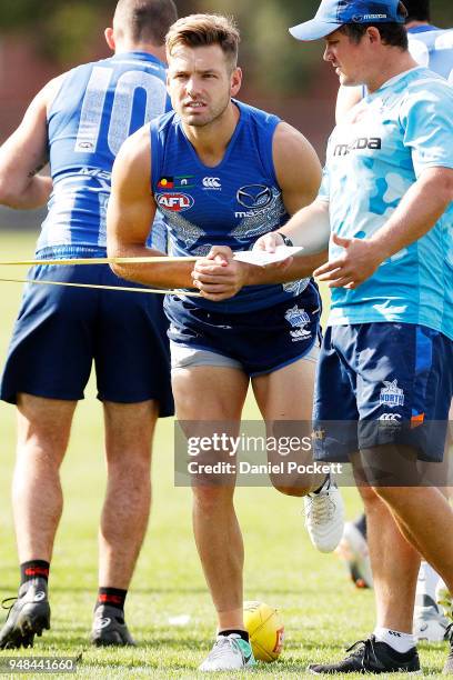 Shaun Higgins of the Kangaroos warms up at Arden Street Ground on April 19, 2018 in Melbourne, Australia.