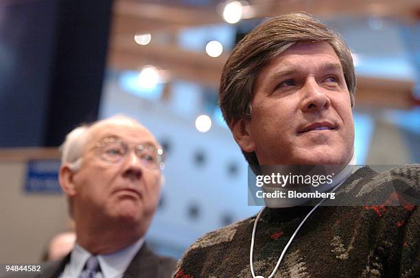Senator Gordon Smith , right, and former Senator Phil Gramm participate in a workshop during the World Economic Forum in Davos, Switzerland on...