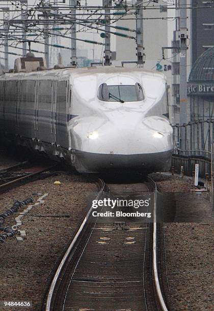 Shinkansen bullet train developed by West Japan Railway Co. And Central Japan Railway Co. Approaches Shin-Osaka Station in Osaka City, Japan, on...