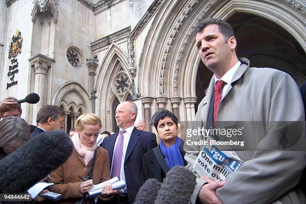 British banker Gary Mulgrew speaks to reporters in front of the Royal Courts of Justice building in central London,Tuesday, February 21, 2006. The...