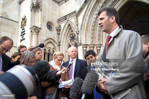 British banker Gary Mulgrew speaks to reporters in front of the Royal Courts of Justice building in central London,Tuesday, February 21, 2006. The...