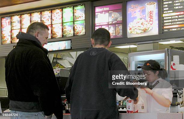 Two customers order food at a McDonald's restaurant in Winnetka, Illinois on Thursday, January 27, 2005. McDonald's Corp., the world's largest...