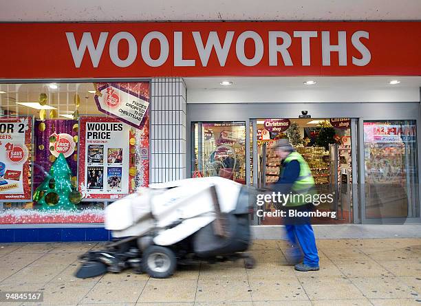 Street cleaner passes the Woolworths store in Romford, Essex, U.K., on Thursday, Nov. 27, 2008. Woolworths Group Plc appointed administrators for its...