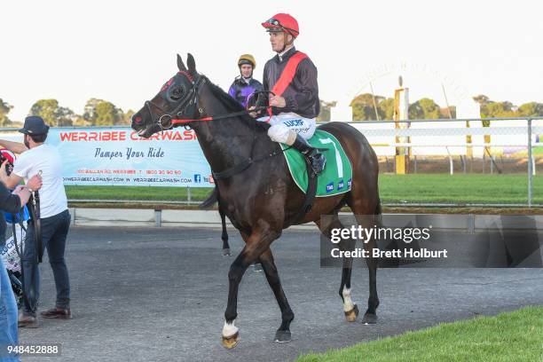 Jarrod Fry returns to the mounting yard on Crisis Point after winning the Werribee Open Range Zoo BM58 Handicap at Werribee Racecourse on April 19,...