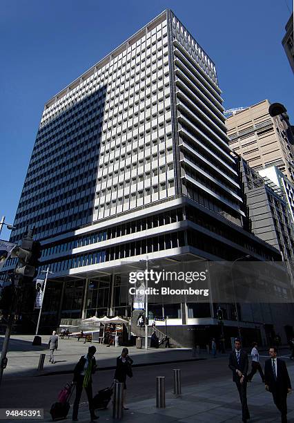 Pedestrians pass in front of the Reserve Bank of Australia building in Sydney, Australia, on Tuesday, Sept. 2, 2008. Australia's central bank cut its...