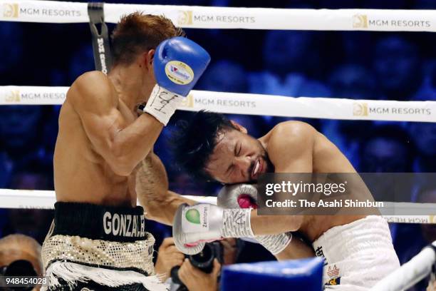Challenger Cristofer Rosales of Nicaragua connects his left on former champion Daigo Higa of Japan in the 6th round of the WBC Flyweight Title Bout...