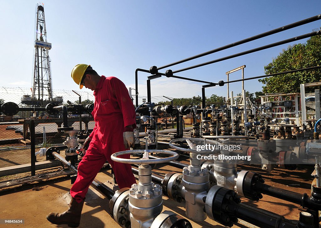 A worker checks a pumping and filtering station at a PTT Exp
