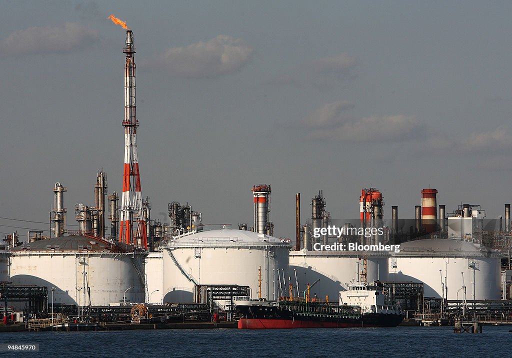 Storage tanks stand at a TonenGeneral Sekiyu KK oil refinery