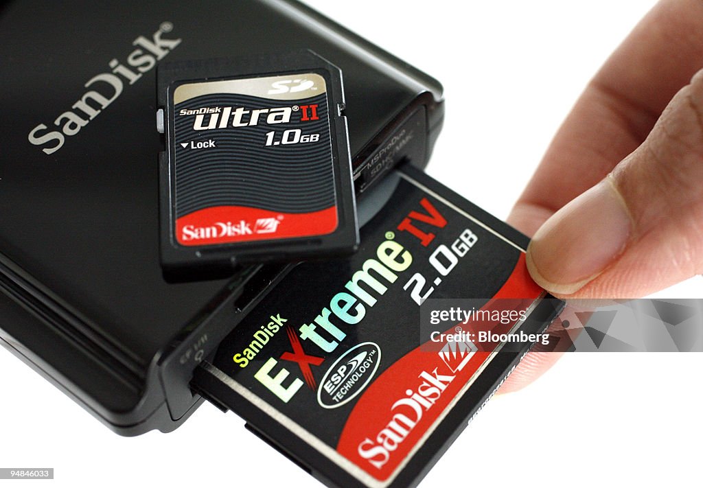 A woman uses a SanDisk memory card and card reader in Berlin