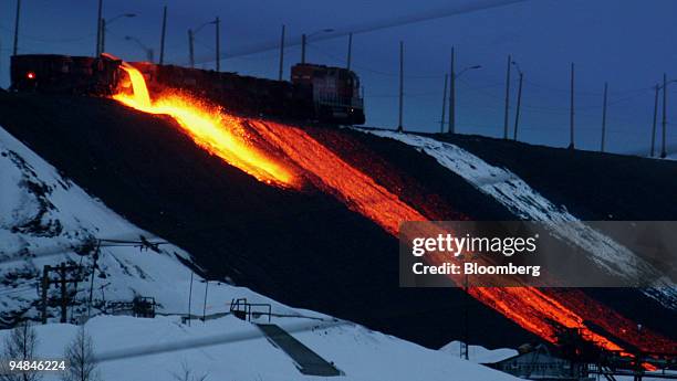 An Inco slag train pours molten refuse every few hours from the Inco nickel refinery in Copper Cliff, a suburb of Sudbury, Ontario, Canada, February...