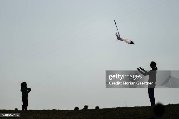 Child and an adult have a kite go up on the Drachenberg in Berlin on April 08, 2018 in Berlin, Germany. The Teufelsberg or Drachenberg is a hill...