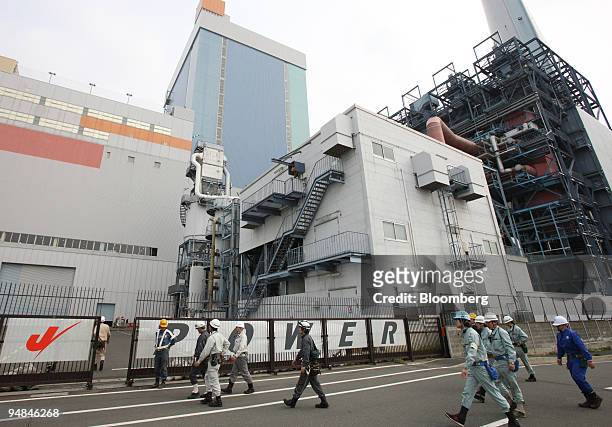 Workers enter Electric Power Development Co.'s Isogo power station in Yokohama City, Japan, on Monday, April 28, 2008. J-Power said it won't be easy...
