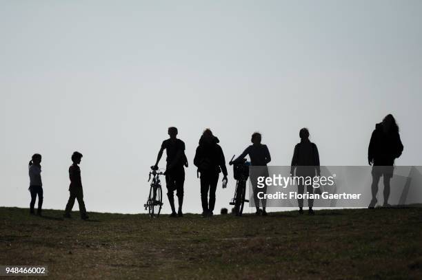 Five adults and two children on a walk on the Drachenberg in Berlin on April 08, 2018 in Berlin, Germany. The Teufelsberg or Drachenberg is a hill...