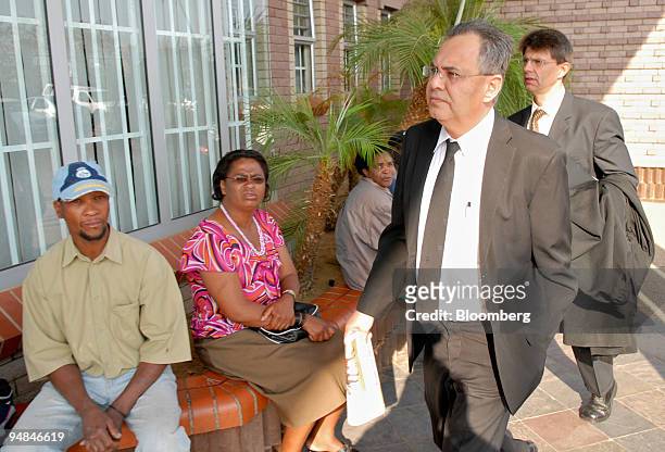 Jacob " Kobi'' Alexander, second right, the former Comverse Technology Inc. Chief executive officer, accompanied by Louis du Pisani, right, a member...