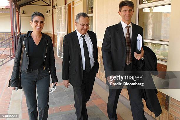 Jacob " Kobi'' Alexander, the former Comverse Technology Inc. Chief executive officer, center, accompanied by his wife Hana, left, and his lawyer,...