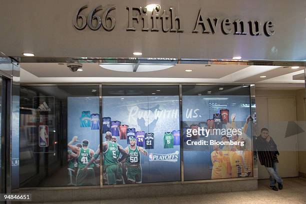 Man talks on his mobile phone outside the NBA Store at 666 Fifth Avenue in New York, U.S., on Friday, April 25, 2008. Carlyle Group, the world's...