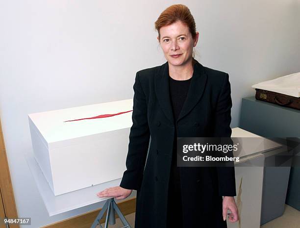 Elena Ochoa Foster, chief executive of Ivory Press poses at her offices in London with Anish Kapoor's book 'Wound'., Tuesday, January 25, 2005.