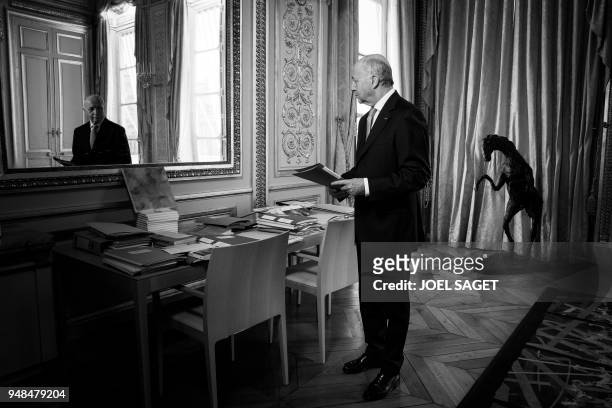 President of the Constitutional Council, Laurent Fabius, poses during a photo session in his office in Paris, on April 18, 2018.