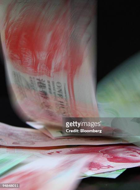 Asian currencies are arranged for a photograph in Tokyo, Japan, on Thursday, April 24. 2008. Asian currencies are 25 percent undervalued against the...