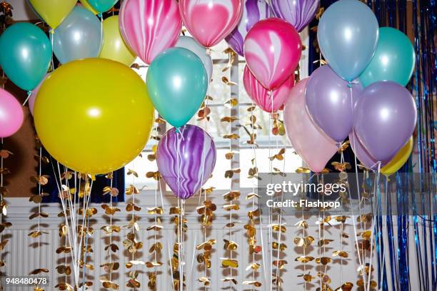 still life of helium balloons - happy birthday stock pictures, royalty-free photos & images