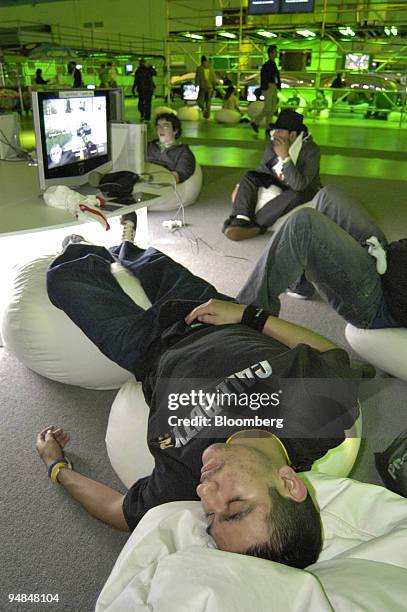 Estaban Rodate sleeps after playing on the new Microsoft Xbox 360 video-game console all night, in Palmdale, California, USA, late Monday, November...