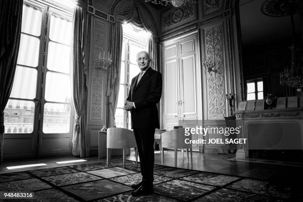 President of the Constitutional Council, Laurent Fabius, poses during a photo session in his office in Paris, on April 18, 2018.
