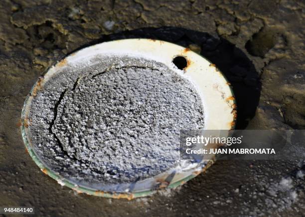 By Oscar Laski Picture of a metalic plate covered with salt at Lago Epecuen village, some 600 km southwest of Buenos Aires, on May 3, 2011 after the...