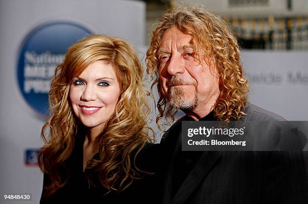 Rock great Robert Plant of Led Zeppelin, right, and country singer Alison Krauss arrive at the Nationwide Mercury Prize awards at Grosvenor House...