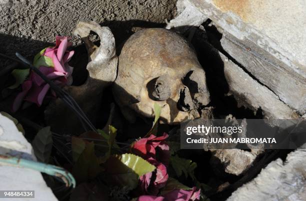 By Oscar Laski Detail of a damage tomb at the cemetery of Carhue town near Lago Epecuen village, some 600 km southwest of Buenos Aires, taken on May...