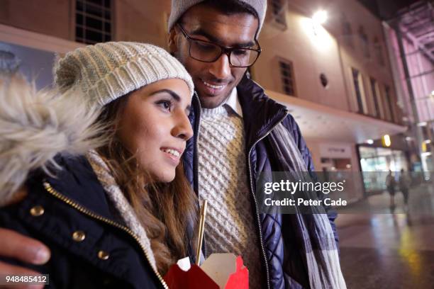 couple in city at night - devon winer stock-fotos und bilder