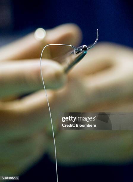 Doctor prepares to provide stitches at a hospital in London, U.K., on Thursday, Nov. 20, 2008. Funding to tackle hospital infections such as...